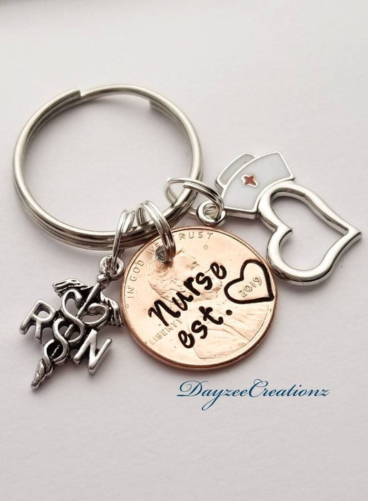 Nurse penny keychain with charms shown