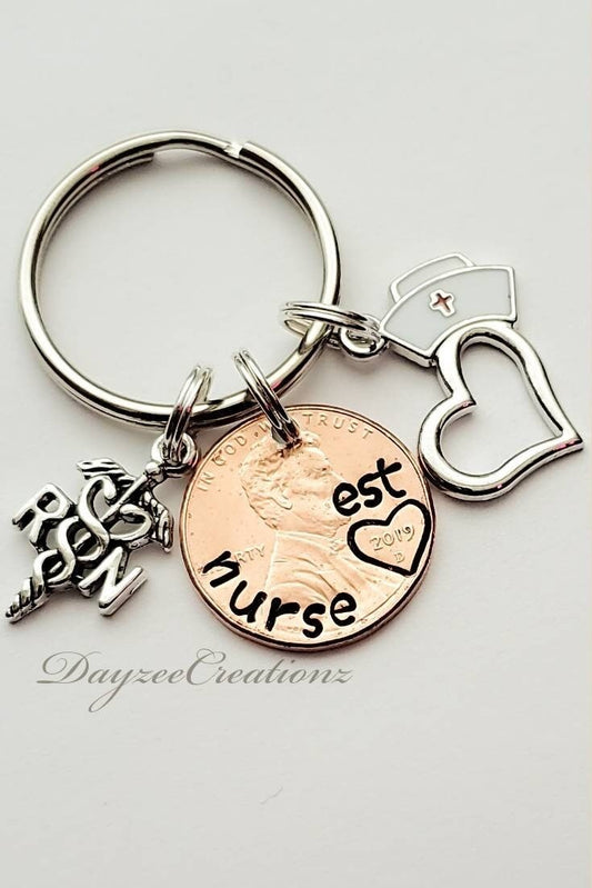 Nurse penny keychain with charms shown