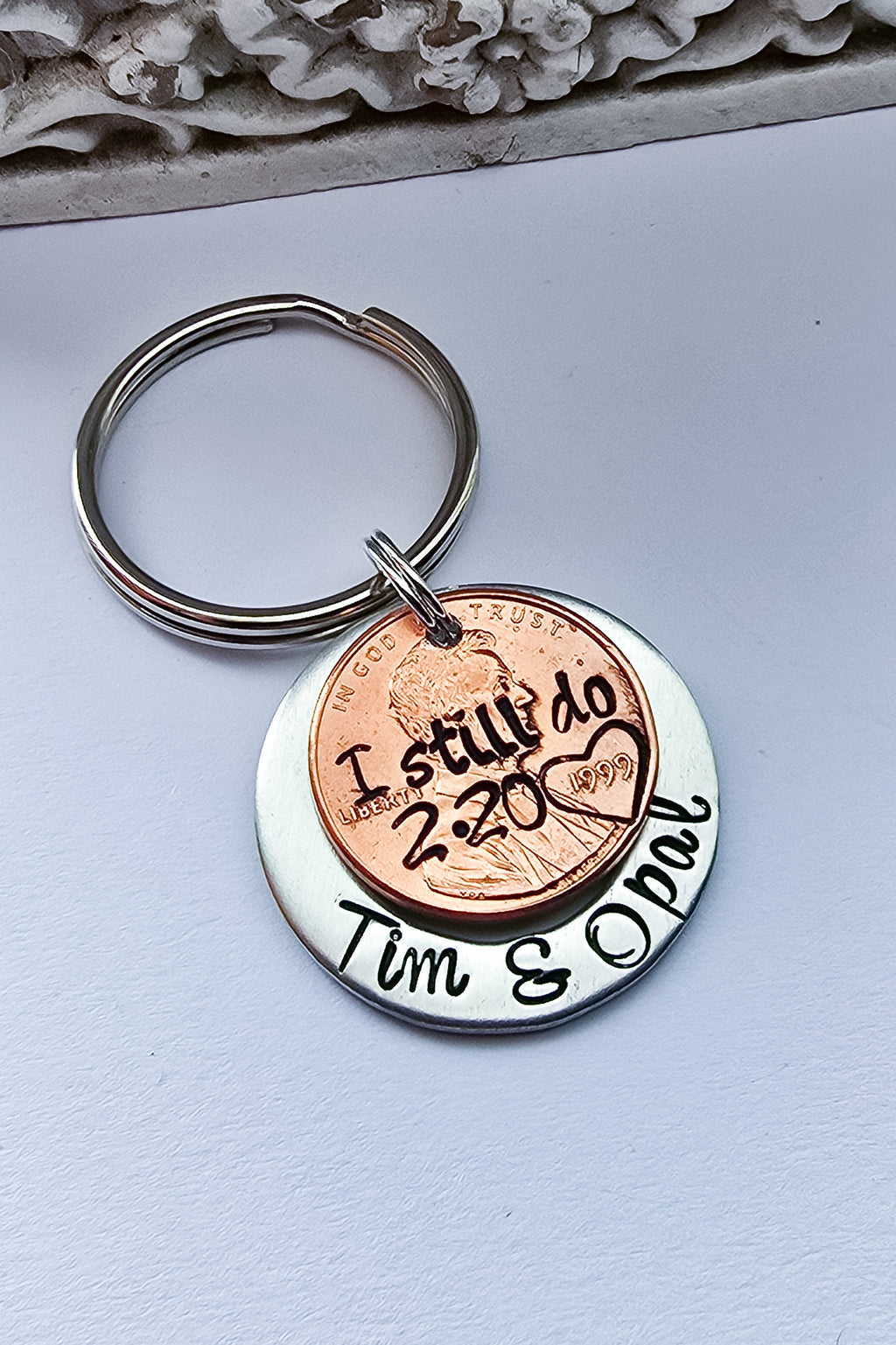I still do penny stacked on silver disc with names  engraved