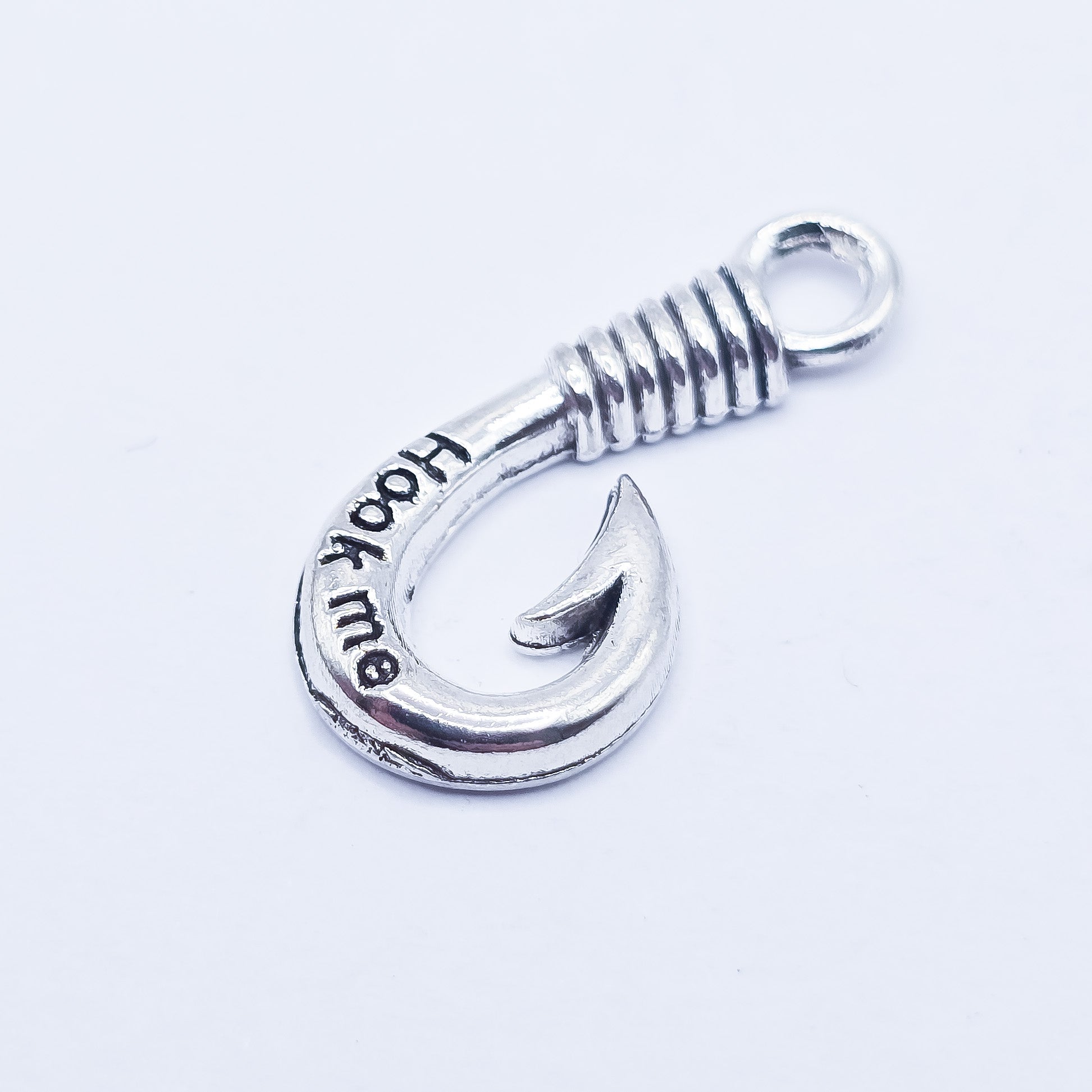silver fishing hook charm with "hook me" imprinted