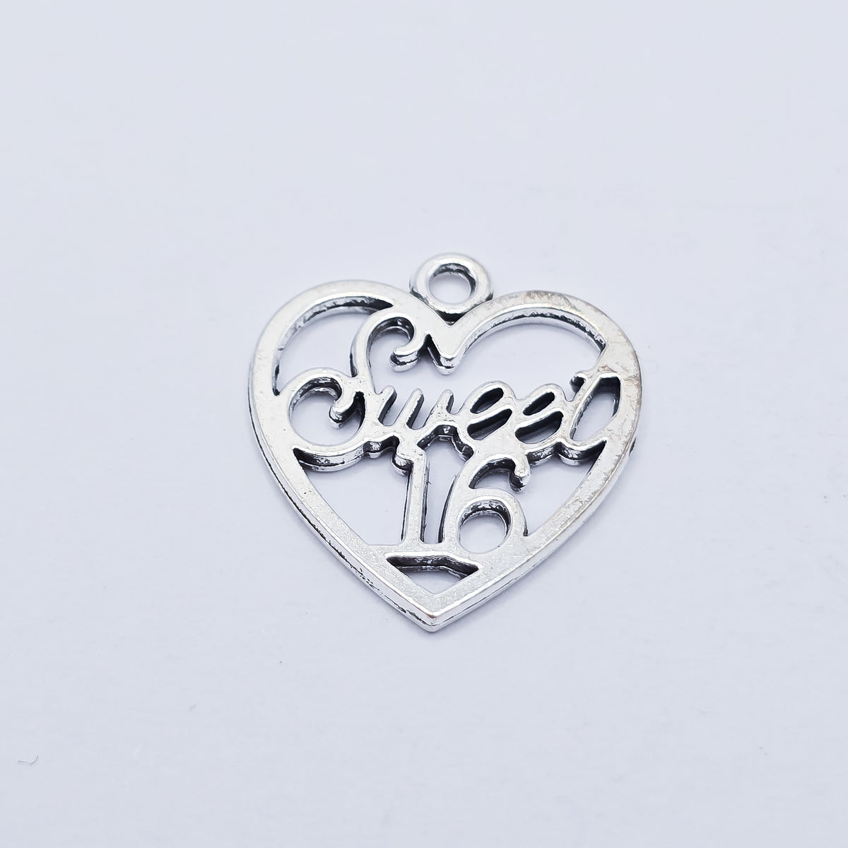 silver heart with sweet 16 in the middle2