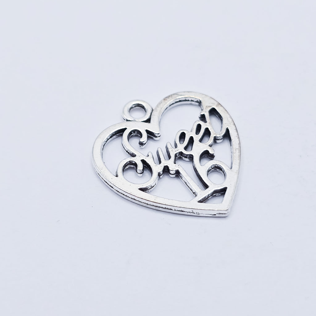 silver heart with sweet 16 in the middle