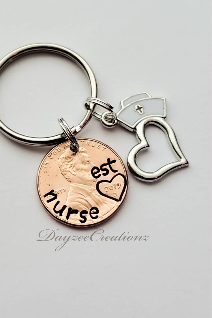 Nurse penny Keychain with charms shown