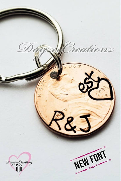 Anniversary Penny Keychain with initials stamped on the curve and "est." stamped above penny year 2